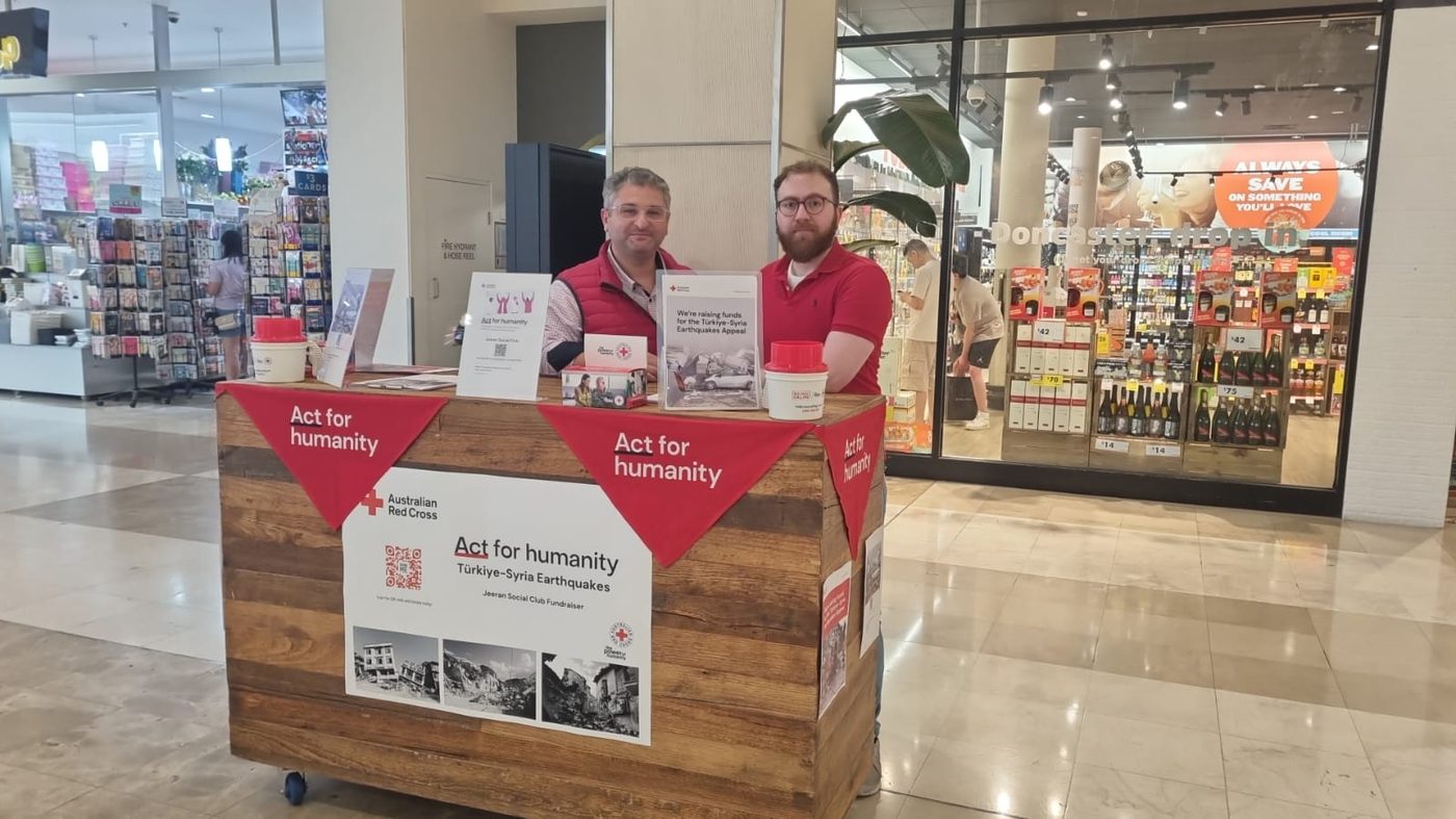 Two Jeeran volunteers in red at the club’s Red Cross fundraising stall at Westfield Doncaster